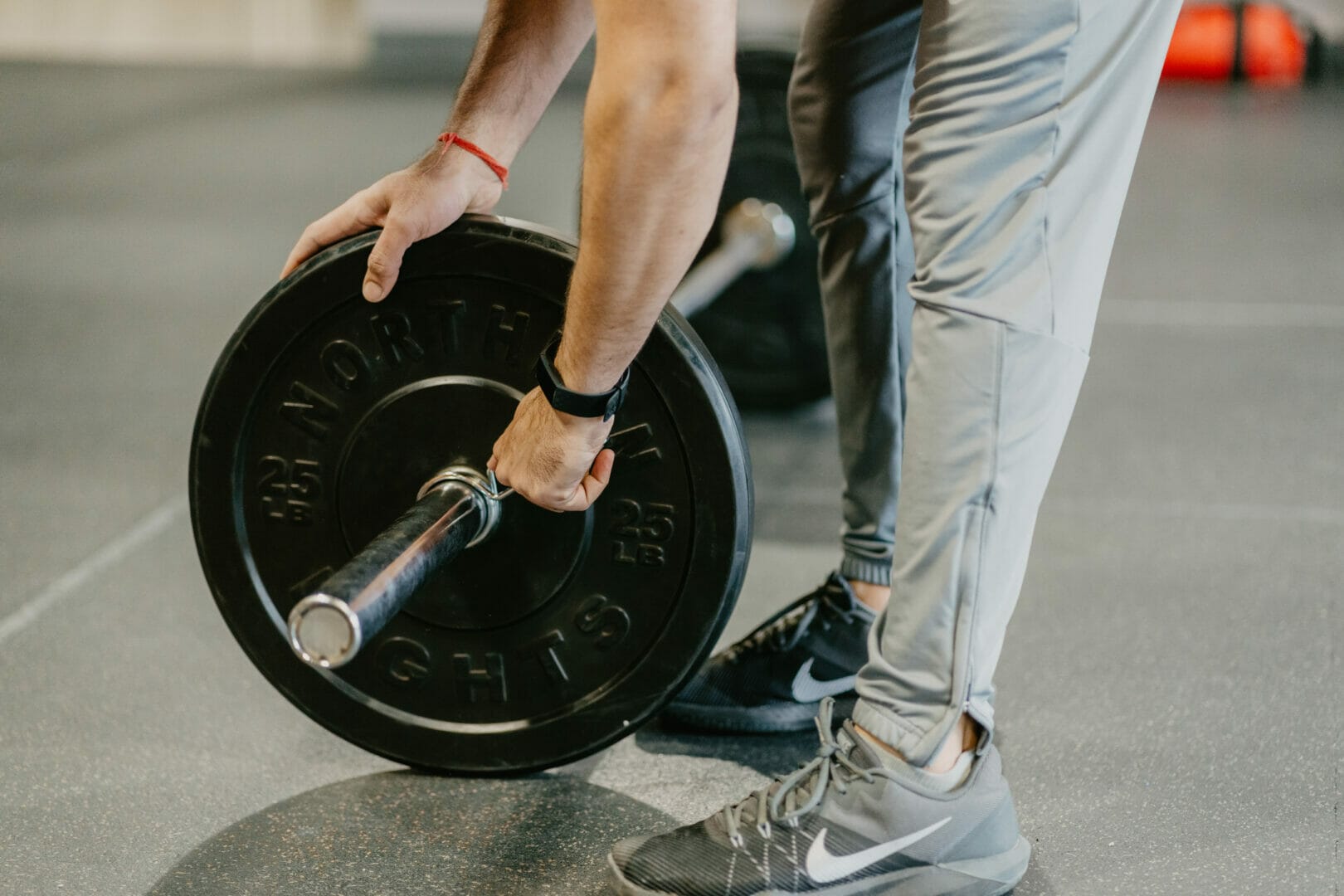 Can You Do CrossFit if You're Overweight? 1 man lifting weights at the best gym in town