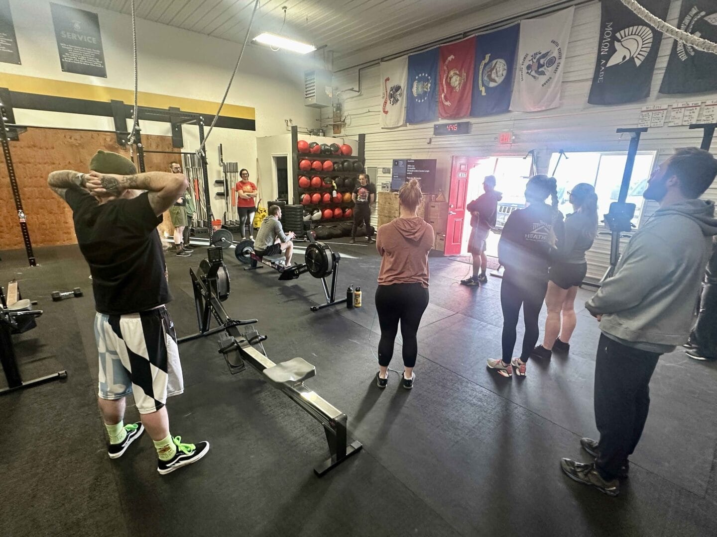 What Is Functional Fitness Training? 1 Group Listening to Coach